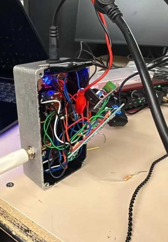 A picture of the rear of the pedal enclosure with loose wires hanging out.